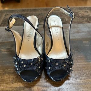 Strapping, sparkly patent navy heels